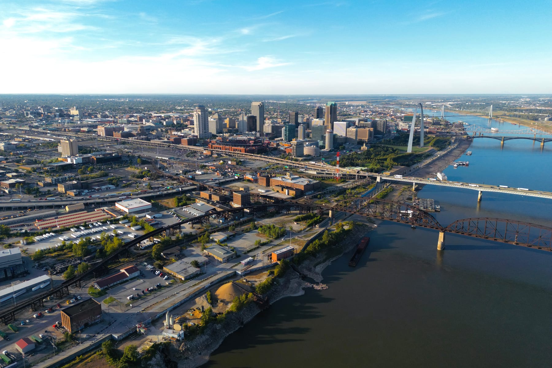 Aerial view of the Gateway South district in downtown St. Louis, looking north up the Mississippi River toward the skyline and the Gateway Arch